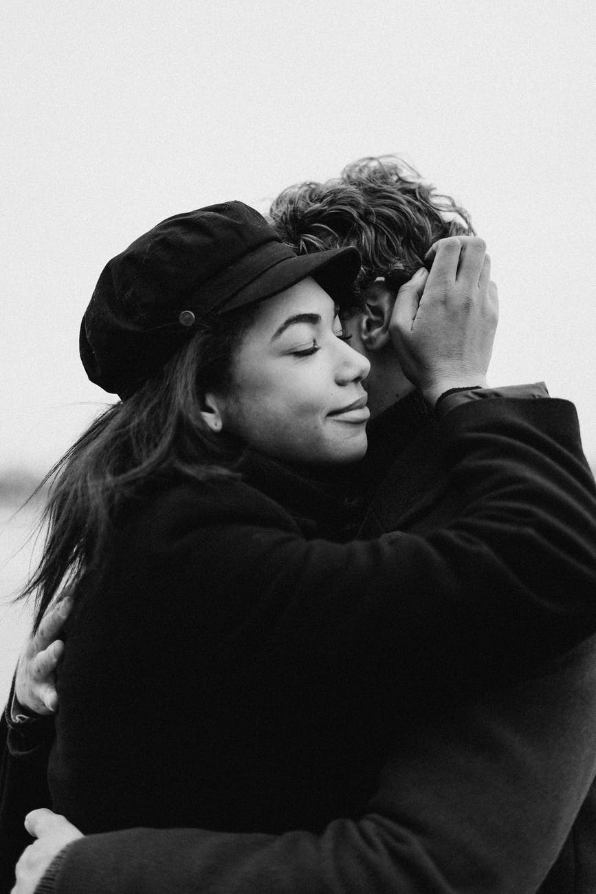 monochrome photo of woman wearing black hat